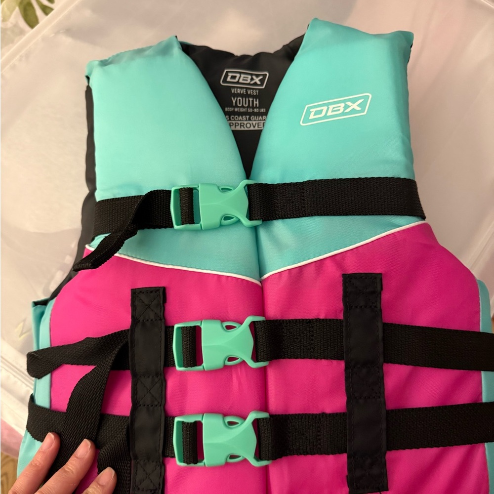 Vibrant Pink and Blue Life Vest with Secure Buckles